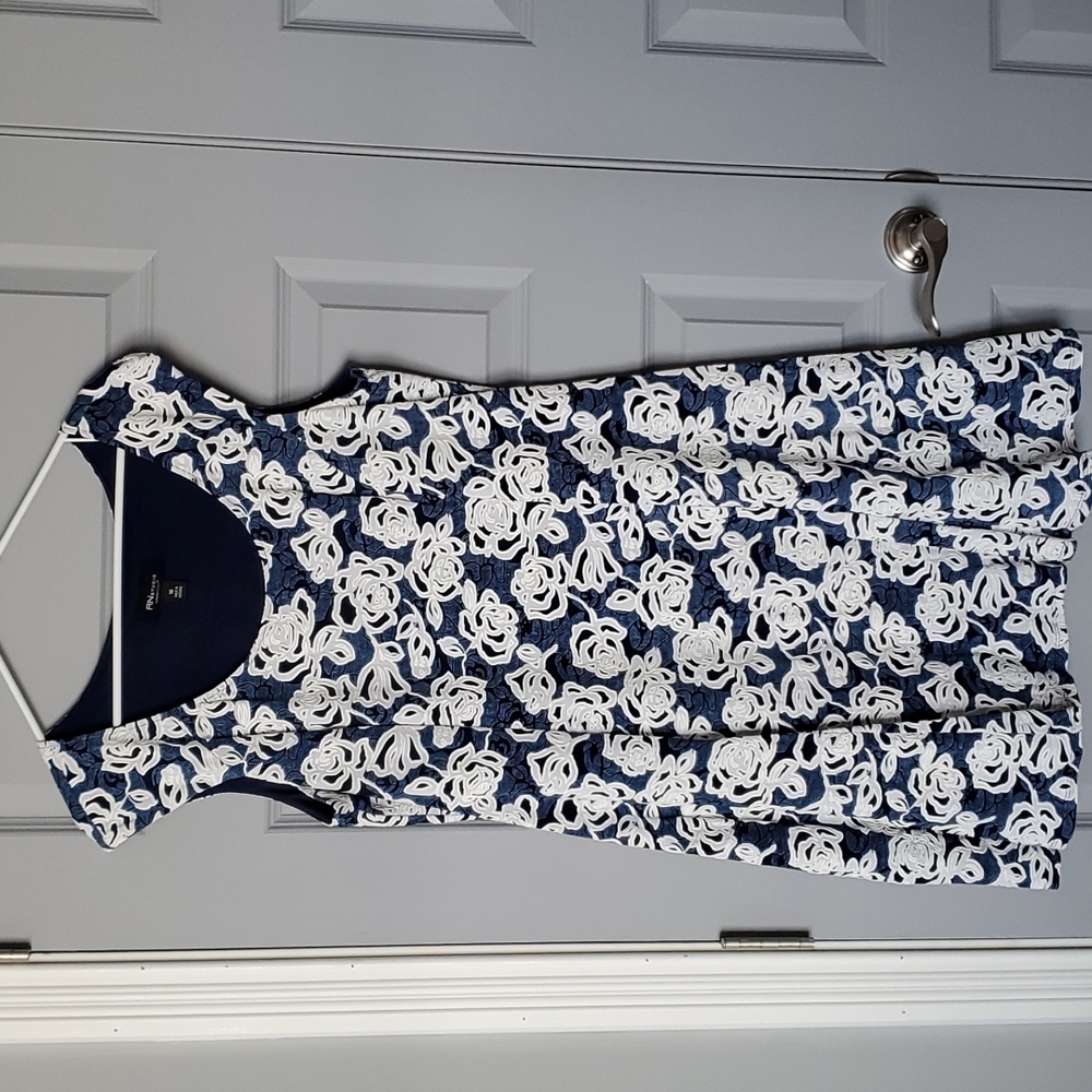 Beautiful navy with white applique flowers. Size 16